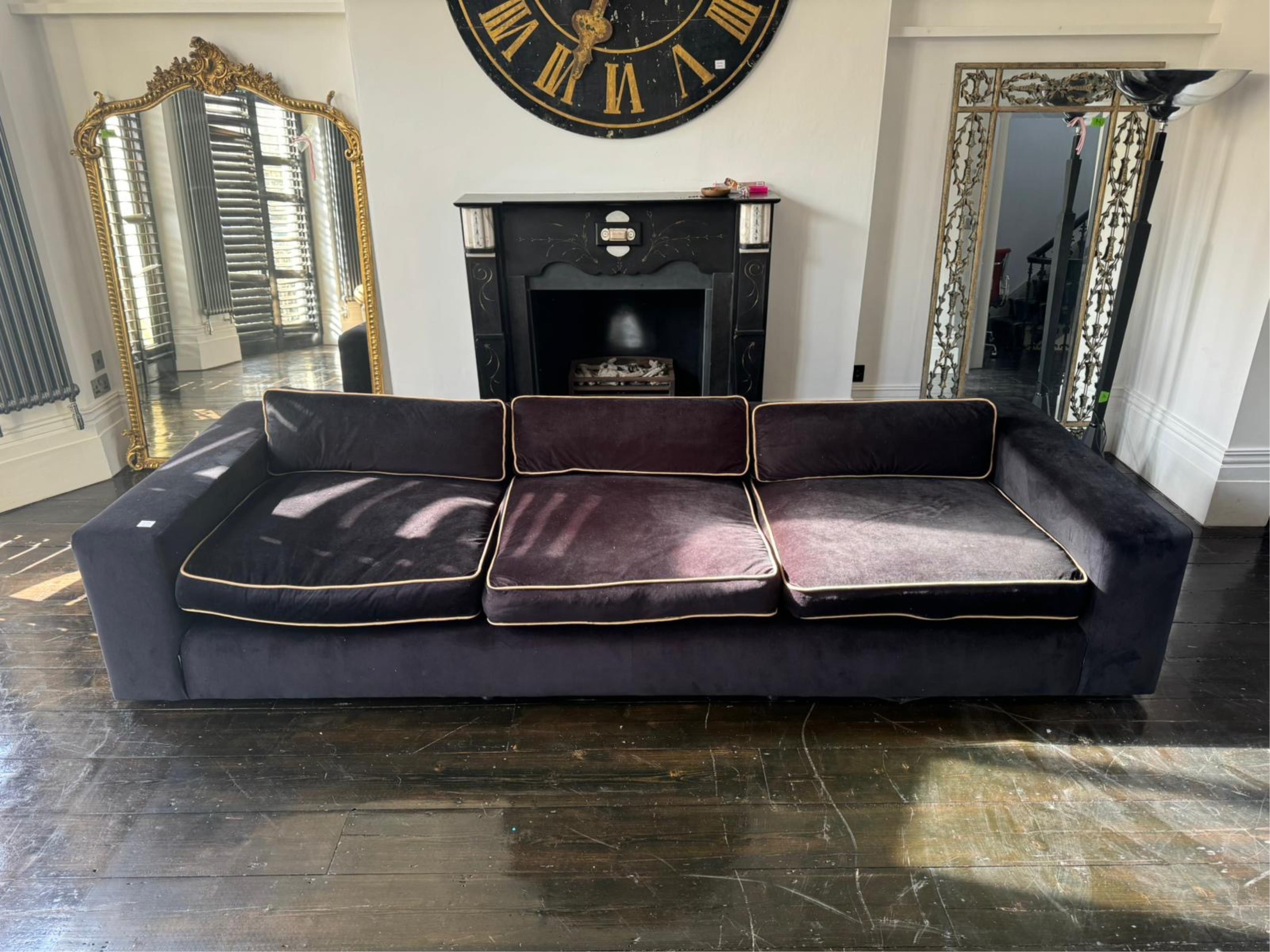 DFP design, a black velvet sofa width 320cm, depth 121cm, height 60cm. Condition - fair